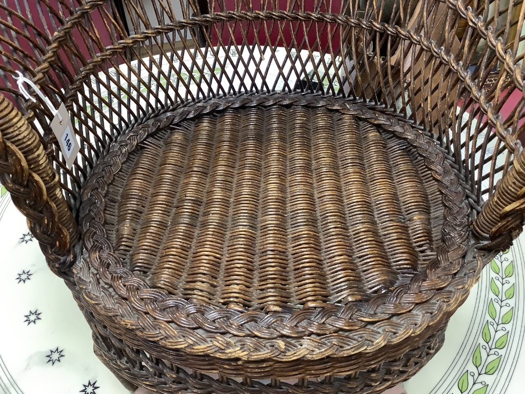 An early 20th century cane tub chair, width 80cm height 70cm